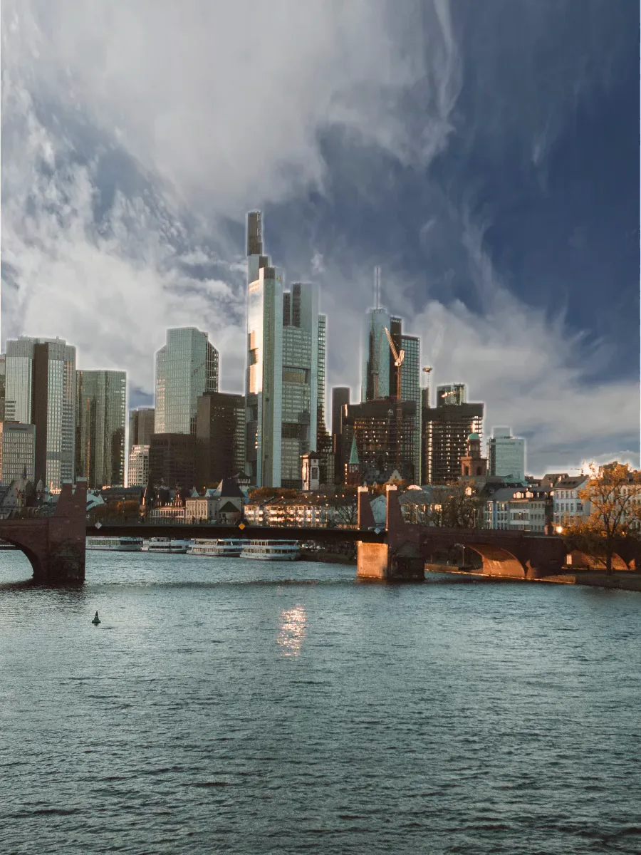 The Frankfurt skyline under a dramatic moving sky swapped in by Swish.