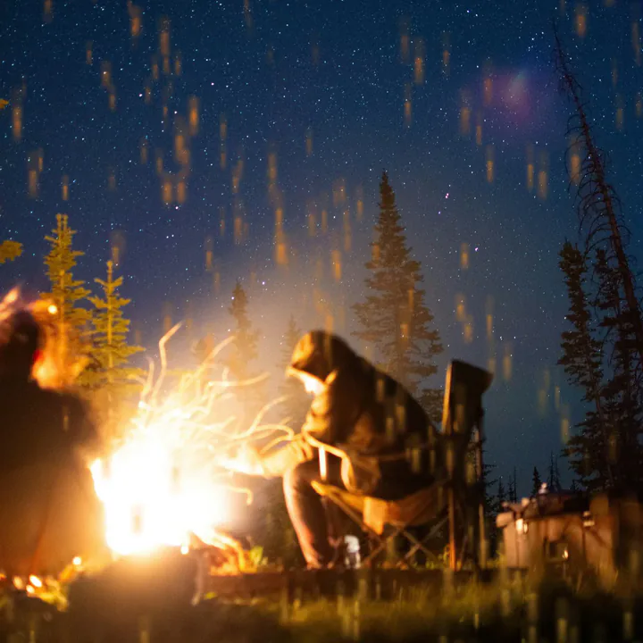 Embers rising over a photo.